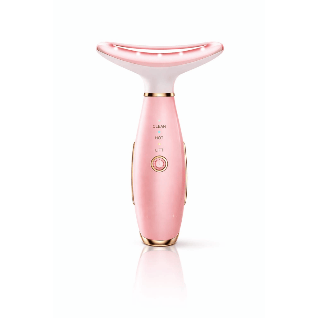 Pink and white skincare device on a white background