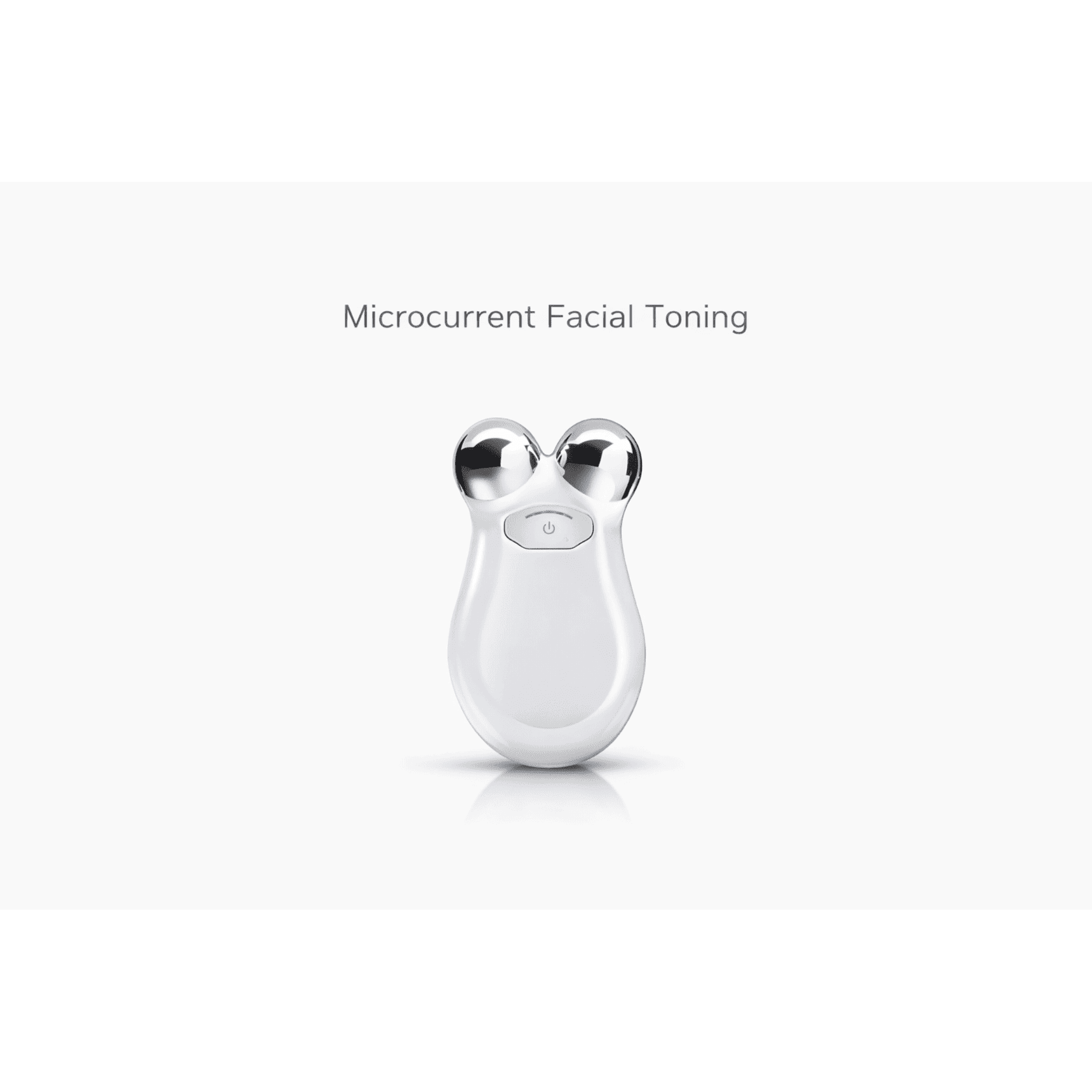White facial toning device with silver accents on a white background